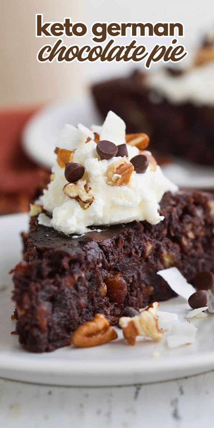 a close up of a piece of cake on a plate with whipped cream and pecans