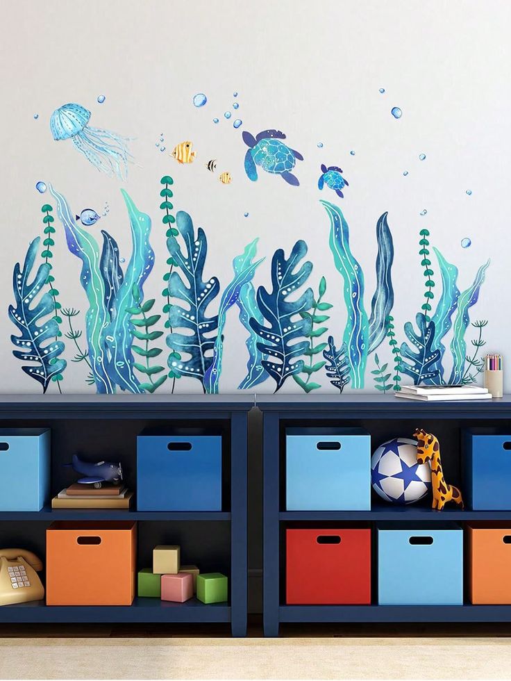 an ocean scene with seaweed, fish and jellyfish wall decals on the walls