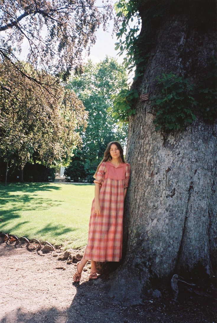 Vintage plaid dress featuring a smock shape, a front cotton bib with small ribbon and slight puffed sleeves. This dress is a little sheer and has a loose fitting waist.   size: 36 measurements: shoulders 32cm bust 41cm / length 116cm  sizing: best fits small/medium model : 170cm and wears 36 material: 100% cotton condition: good vintage condition  flaws: none    Please keep in mind that, unless otherwise stated, our vintage items are pre-worn, pre-loved, and have had a previous lifetime -- or even several. Vintage items may have normal wear caused by age and use such as discolouration, small loose threads and may vary from the standardised clothing sizes of today. Short Sleeve Gingham Smock Dress, Cottagecore Plaid Dress With Short Sleeves, Plaid Puff Sleeve Dress For Picnic, Plaid Cottagecore Dress For Picnic, Plaid Short Sleeve Midi Dress For Daywear, Plaid Puff Sleeve Dress For Picnics, Cottagecore Plaid Dress For Picnic, Plaid Smocked Short Sleeve Dress, Spring Plaid Smock Dress