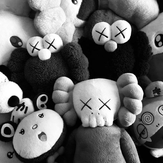 a bunch of stuffed animals that are all different shapes and sizes with crosses painted on them