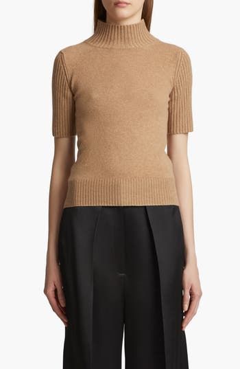 Sumptuous cashmere furthers the luxe look and feel of this mock-neck sweater with finely ribbed trim. Since its founding in 2016, this New York label has made its mark with fashion insiders, thanks in part to Catherine Holstein's coveted knits. 20 1/2" length (size Medium) Mock neck Short sleeves Ribbed cuffs and hem 100% cashmere Dry clean Imported Designer Clothing Camel Sweaters, Favorite Daughter, Romantic Dress, Mock Neck Sweater, Designer Clothes For Men, Comfortable Dress, Athletic Women, Autumn Fashion Women, Fashion Essentials