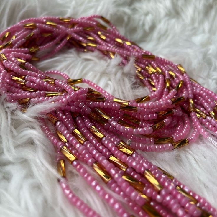 Waist Beads Tie On. Pink And Gold 42- 45 Inches Long Flexible For Sizing Being Tie On. If Smaller Waist Can Take Some Off And Then Tie On. Pink And Gold Waist Beads, Adjustable Pink Waist Beads With Spacer Beads, Pink Gold Beaded Jewelry For Party, Pink Party Jewelry With Gold Beads, Pink Tiny Beads Waist Beads For Gift, Elegant Pink Beaded Necklace With Tiny Beads, Elegant Pink Necklaces With Gold Beads, Elegant Pink Necklace With Gold Beads, Pink Beach Necklace With Spacer Beads