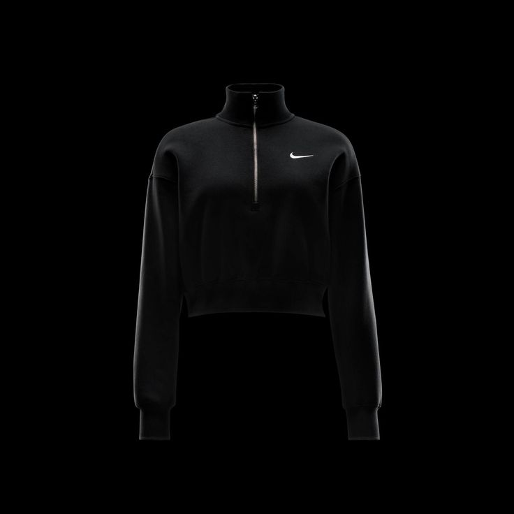 The Nike Phoenix Fleece QZ Women's Crop Top proves activewear doesn't have to be boring. It has a sophisticated style with its raised collar that gives it that extra something something. Moreover, the cropped cut makes it on point with today's fads. Cropped cut. Half-zip. Raised collar. Features embroidered Nike Swoosh on front. Elongated ribbing for added detail. Fabric: body - 80% Cotton, 20% Polyester; rib - 97% Cotton, 3% Spandex. Machine washable. Sporty Black Cropped Sweatshirt, Black Cropped Sporty Sweatshirt, Sporty Half-zip Tops For Streetwear, Sporty Half-zip Streetwear Tops, Sporty Turtleneck Sweatshirt With Ribbed Collar, Sporty Turtleneck Sweatshirt For Loungewear, Fall Sportswear Funnel Neck Tops, Black Cropped Tops With Ribbed Cuffs, Black Cropped Top With Ribbed Cuffs