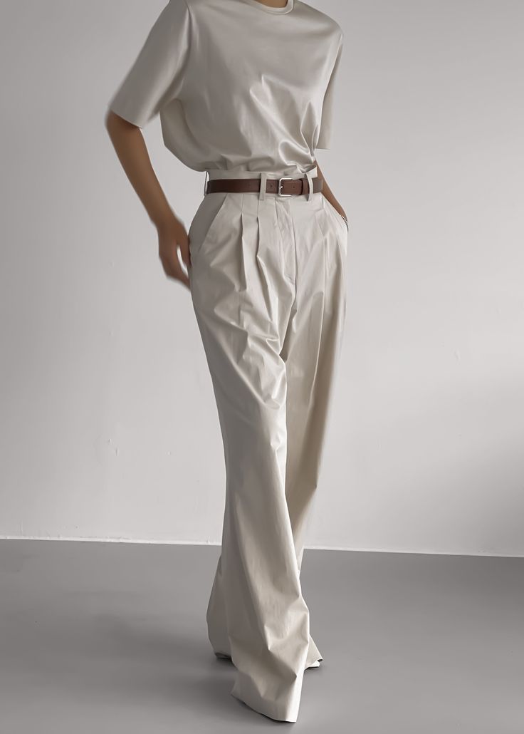 Color: Taupe Lightweight cotton blend fabric Wide leg High rise Pleat front detail Pressed crease Side seam pockets Single illusion welt back pocket Belt loops Hook and bar closure Zip fly Unlined 97% Cotton 3% Polyurethane Dry Clean By The Frankie Shop. Imported The Frankie Shop, Wide Trousers, Frankie Shop, Cotton Trousers, Pocket Belt, Wide Pants, Blouse Outfit, Romper Pants, Pin Tucks