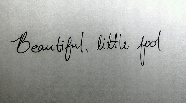 the words beautiful little fool written in cursive black ink on a white piece of paper