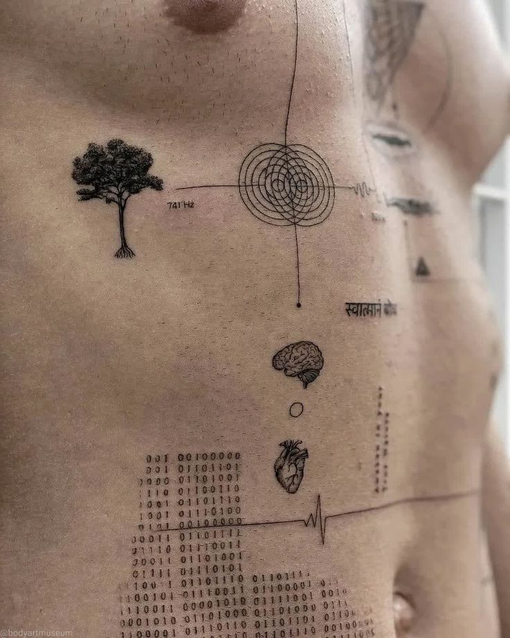 a man's chest with various symbols on it