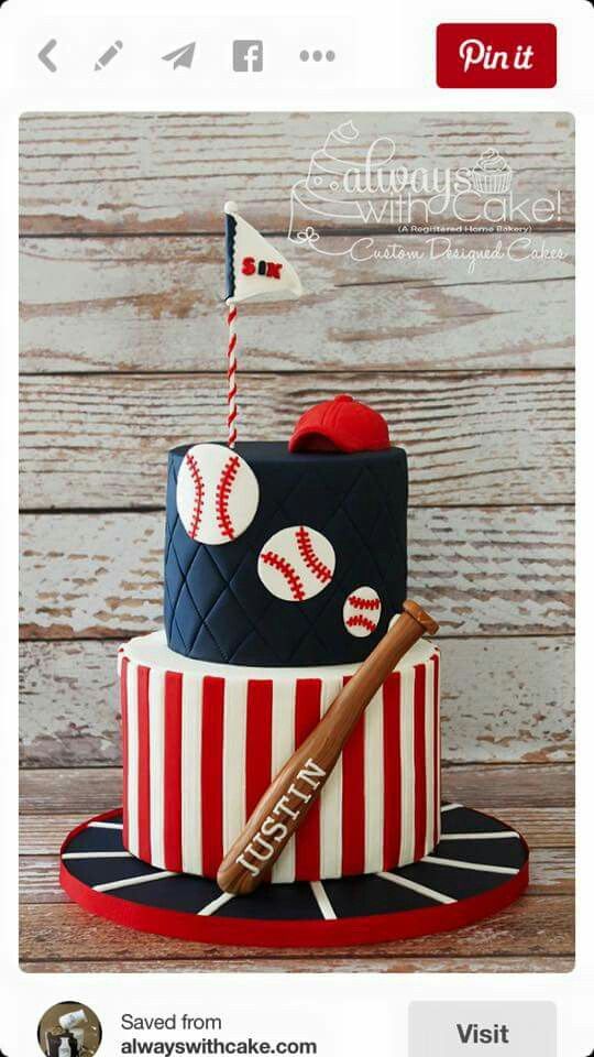 a baseball themed cake with a bat and ball on top