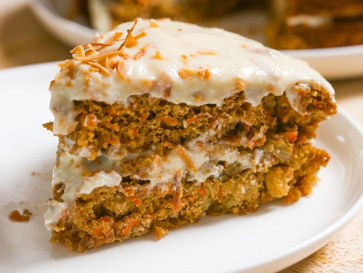 a piece of carrot cake on a white plate