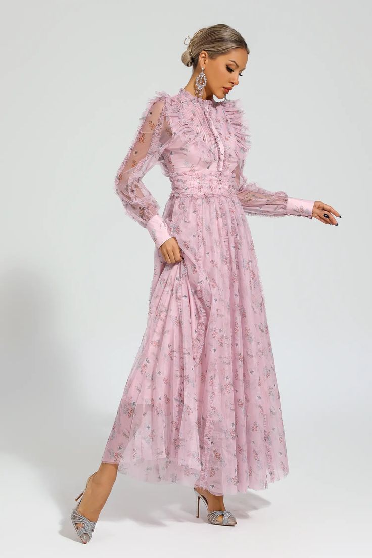 Elevate your style with the Beryl Pink Floral Long Sleeve Dress. Designed with a gentle breeze of femininity, this dress features a high-waisted cut and a Peter Pan collar adorned with delicate frills. Perfect for beach getaways or birthday celebrations, this long dress exudes a graceful charm that will turn heads wherever you go.  Dress Length: Approx 140cm Materials: Polyester Gentle Dry Clean Only  The model is 5 ft 7 and wears size S  Color may vary due to lighting on images. The product ima Elegant Pink Maxi Dress With Ruffled Skirt, Feminine Chiffon Dress With Ruffled Skirt, Elegant Pink Midi Dress With Ruffled Skirt, Chiffon Dress With Ruffled Skirt, Elegant Dresses With Ruffled Skirt For Daywear, Elegant Chiffon Ruffle Dress For Garden Party, Elegant Daywear Dress With Ruffled Skirt, Feminine Chiffon Maxi Dress With Ruffle Hem, Elegant Pink Maxi Length Ruffle Dress