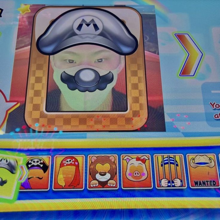 an image of a video game screen with the character mario kartman on it