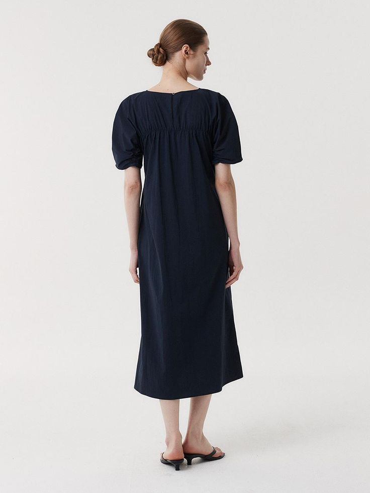 This is a clean and casual dress by EAAH that is made out of high quality and sturdy fabric. With unique design detail and trendy mood, you can style it for your refined and casual daily outfit.- Button and loop closure on the back- Side seam pocket detail- High quality sea shell button- Shirring detail Modern Cotton Midi Dress, Navy Cotton Midi Dress, Elegant Navy Cotton Dress, Navy Cotton Midi Dress For Spring, Classic Navy Dress For Daywear, Navy Cotton Dress For Work, Modern Cotton Dresses For Daywear, Modern Cotton Daywear Dress, Elegant Fitted Dresses For Everyday