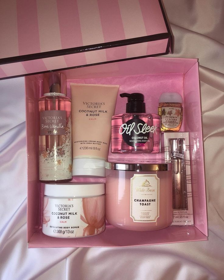 an open pink box containing various skin care products