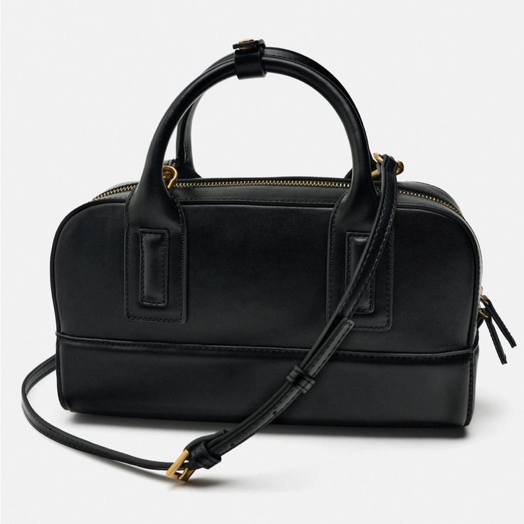 Duffle Bag. Handles And Removable, Adjustable Crossbody Strap. Zip Closure. Height X Length X Width: 6 X 11.7 X 4.5 Inches (15.2 29.2 X 11.4 Cm) Versatile Top Handle Box Bag With Zipper Closure, Black Box Bag For Work, Black Satchel Box Bag For Work, Versatile Black Shoulder Bag With Gold-tone Hardware, Zara Crossbody Shoulder Bag For Travel, Zara Shoulder Bag With Detachable Strap For Travel, Workwear Top Handle Bag With Zipper, Top Handle Bag With Zipper Closure For Work, Zara Crossbody Satchel With Removable Pouch