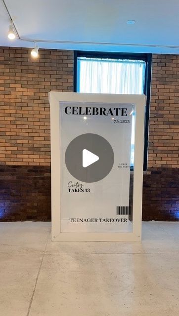 a sign that is in front of a brick wall with the words celebrate on it