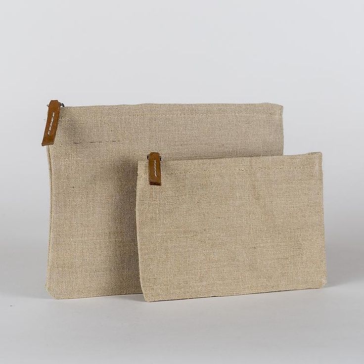 Jute is an amazing natural and sustainable material, so we made a set of zippered pouches in a size that works well for so many things. With a striped cotton lining and leather pull, it's perfectly elegant on its own or as an organizer in your bag or backpack. Set of two. Beige Rectangular Zipper Pouch, Daily Use Beige Pouch With Zipper Pocket, Eco-friendly Everyday Rectangular Pouch, Natural Rectangular Everyday Pouch, Everyday Natural Rectangular Pouch, Eco-friendly Everyday Cosmetic Pouch Bag, Everyday Beige Zipper Pouch, Eco-friendly Rectangular Everyday Pouch, Eco-friendly Rectangular Pouch For Everyday Use