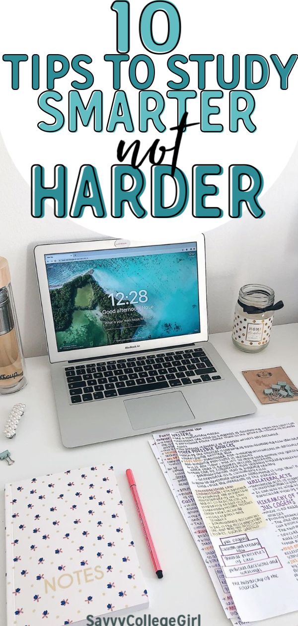 an open laptop computer sitting on top of a desk next to a notepad and pen