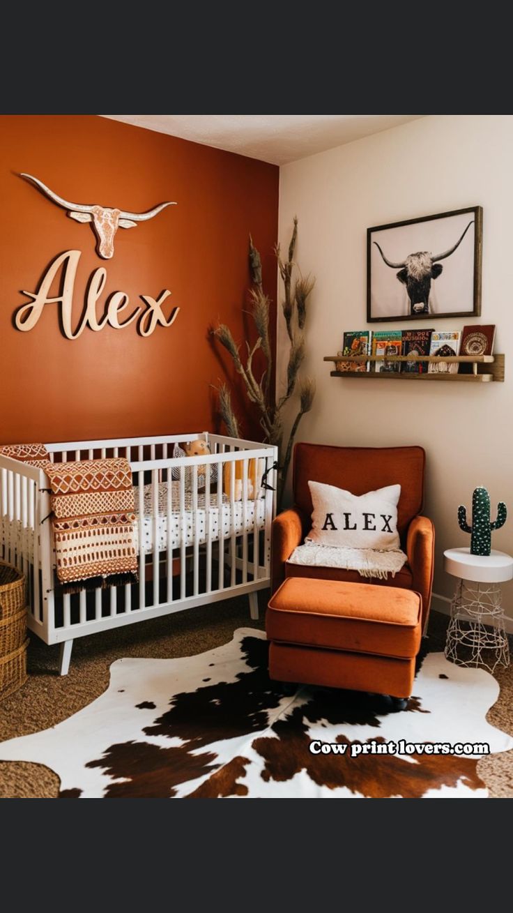 a baby's room with an orange chair and cow skin rug