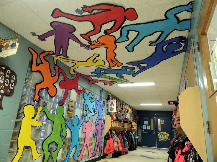 the hallway is decorated with colorful paper cutouts