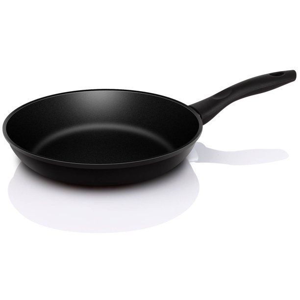 a black frying pan sitting on top of a white counter