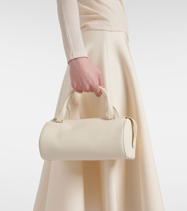 Edith leather shoulder bag in white - The Row | Mytheresa Timeless Beige Shoulder Bag With Handle Drop, Timeless Beige Clutch Shoulder Bag, Cream Evening Shoulder Bag, Elegant Cream Leather Shoulder Bag, Beige Calf Leather Shoulder Bag, Timeless Beige Soft Leather Shoulder Bag, Luxury Cream Shoulder Bag With Double Handle, Classic Cream Shoulder Bag For Evening, Luxury Cream Satchel Shoulder Bag