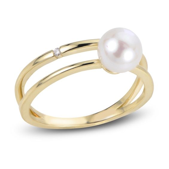 A lustrous freshwater cultured pearl shimmers with elegance in the center of this magnificent women's open shank ring, fashioned in 14K yellow gold. A brilliant round diamond accent embellishes the band to complete the look. Anniversary Yellow Gold Pearl Ring With Diamond, Elegant Gold Pearl Ring With Diamond Accents, Yellow Gold Rings With Diamond Accents And Pearl, Elegant Open Band Pearl Ring, Elegant 14k Gold Pearl Ring With Diamond Accents, Yellow Gold Pearl Diamond Ring With Accents, Elegant Gold Round Cut Pearl Ring, Gold Pearl Ring With Diamond Accents, Timeless Gold Pearl Ring With Diamond Accents