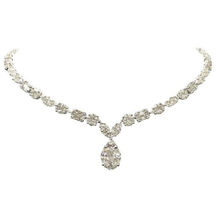 Glamour drops collection - glamour is a sense of luxury , GiLIN 's master craftsmen have set the white diamonds at different angles to form a beautiful necklace with different size diamond drops . The setting maximize the fire and brilliance . It's sparkle and luxury ! Necklace - Length: 17" / Width: 4.5 mm / Depth: 2.34 mm Main Stone - Width: 8.69 mm / Height: 13.61 mm / Depth: 4.29 mm 18 Karat White Gold: 21.08 gm / Total Diamond Weight: 14.14 ct Baguette Diamond 12 pcs / Tapper Diamond 30 pcs White Gold Diamonds Necklace, Gold Princess Necklace, Sparkling Diamond Jewelry, Daimond Nakeles, Luxury Necklace Diamonds, Fancy Umbrella, Vintage Diamond Necklace, Diamond Statement Necklace, Luxurious Necklace