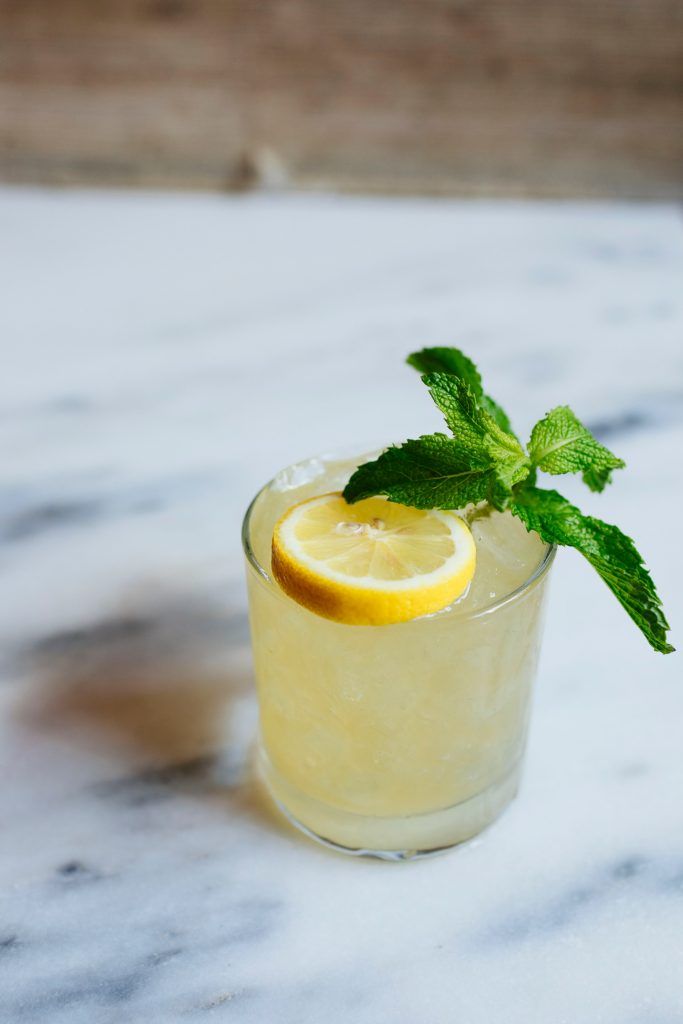 a glass filled with lemonade and mint garnish