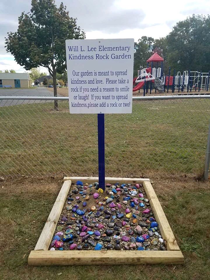 there is a sign that says will i lee elementary children rock garden? on it