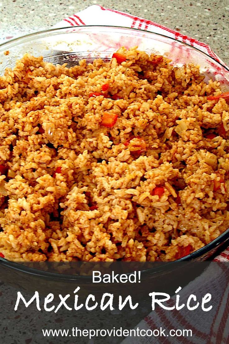 baked mexican rice in a glass bowl on a red and white checkered cloth with text overlay