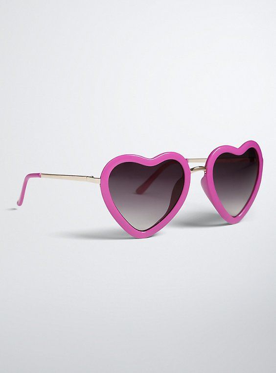 We've got hearts in our eyes! And eyes only for these sunglasses. The festival-ready shades sport magenta heart-shaped frames that are cute meets retro. 100% UV Protection. Man-made materials. Imported. The best plus size women's heart shaped sunglasses eyewear in pink. Heart-shaped Sunglasses With Heart Print, Trendy Heart-shaped Sunglasses With Heart Print, Fun Heart-shaped Sunglasses With Heart Print, Trendy Heart-shaped Sunglasses For Valentine's Day, Trendy Heart Print Sunglasses For Valentine's Day, Trendy Valentine's Day Sunglasses With Heart Print, Heart-shaped Plastic Sunglasses With Mirrored Lenses, Playful Heart-shaped Sunglasses With Uv Protection, Heart-shaped Mirrored Sunglasses