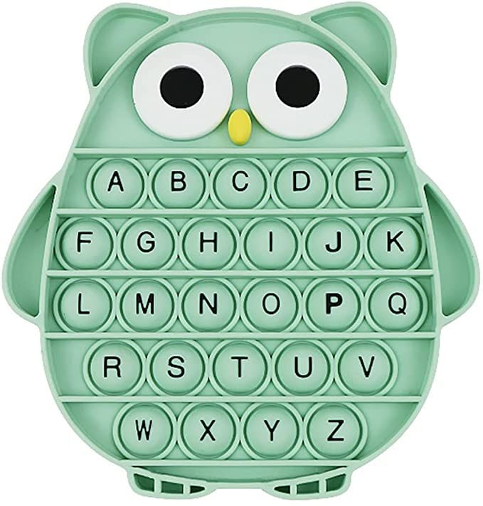 an owl shaped plastic letter tray with eyes