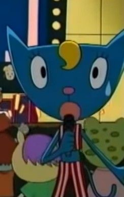 an animated image of a blue cat holding a piece of food in its mouth and looking at the camera