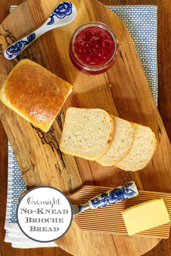 bread, butter and jam on a cutting board