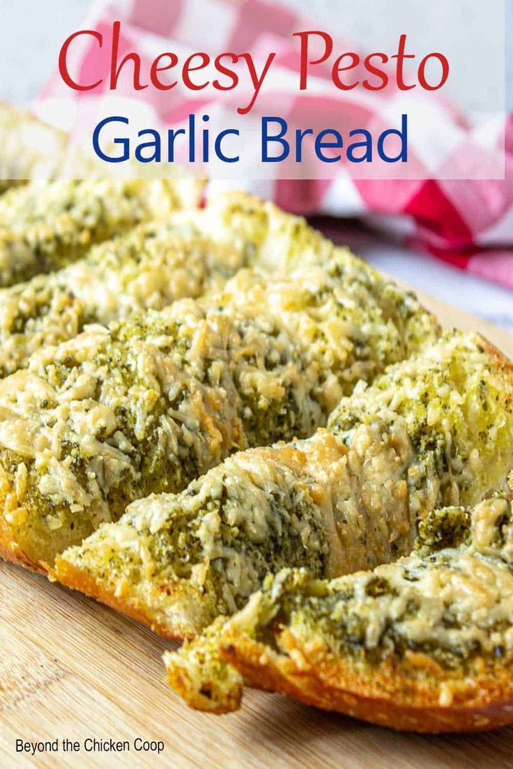 cheesy pesto garlic bread on a wooden cutting board with text overlay