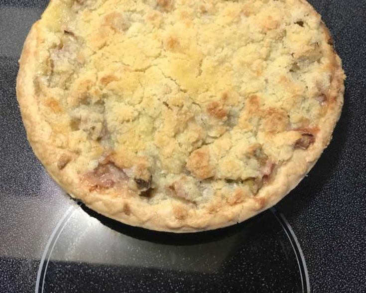 a pie sitting on top of a black counter