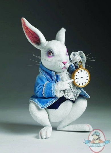 a white rabbit holding a clock in its paws with the caption, i'd on bedausts te keep en newedends gust to genet