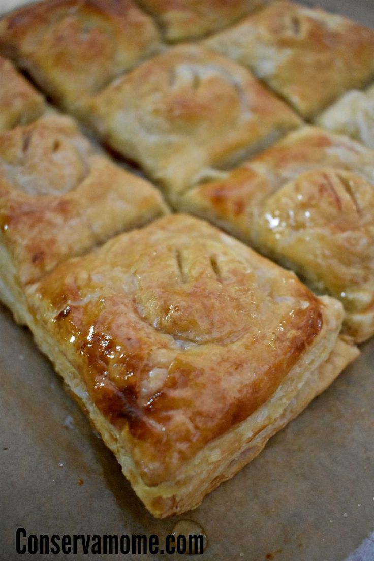 several square pieces of food sitting on top of a pan