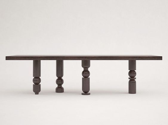 a long wooden table sitting on top of a white floor