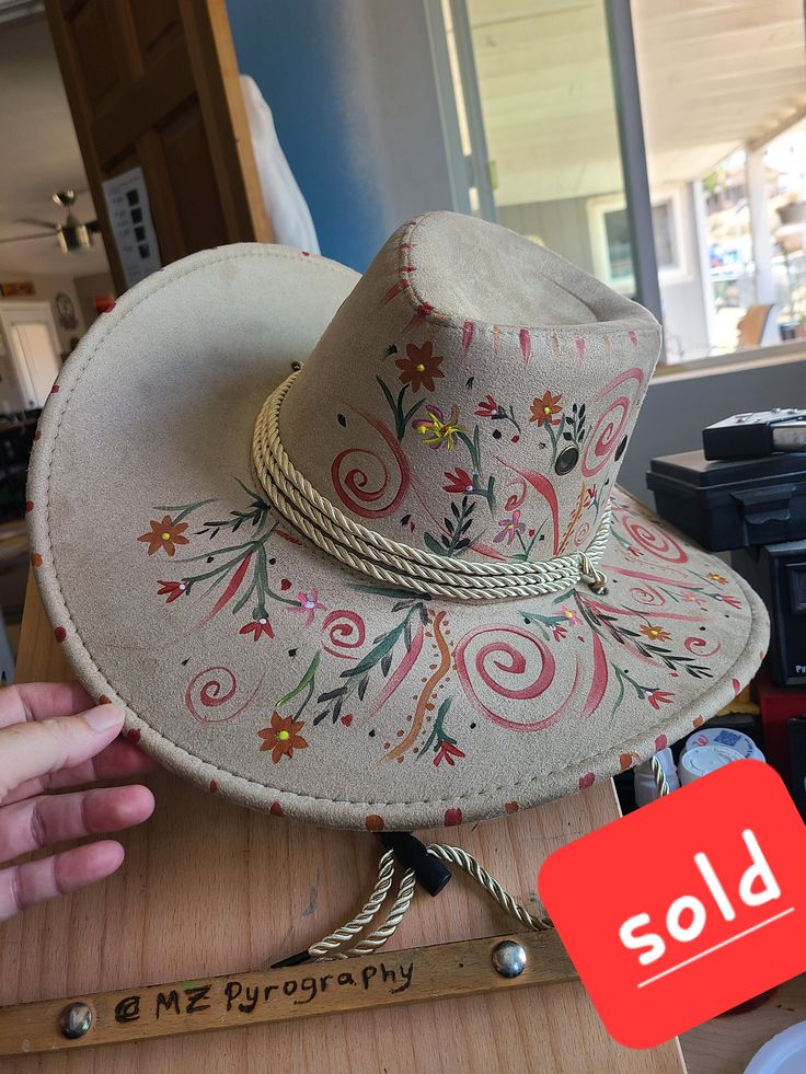 Custom Cowboy/Cowgirl hats with Garden Flowers painted on it. If you would like one similar I can make another one.  Each hat will be slightly different. Adjustable Wide Brim Hand Painted Hats, Adjustable Hand Painted Brimmed Hat, Hand Painted Flat Brim Hat For Rodeo, Hand Painted Brimmed Hats, Artistic Short Brim Hat For Rodeo, Hand Painted Adjustable Western Hat, Adjustable Hand Painted Western Hat, Artistic Adjustable Hat For Rodeo, Artistic Curved Brim Hat For Rodeo