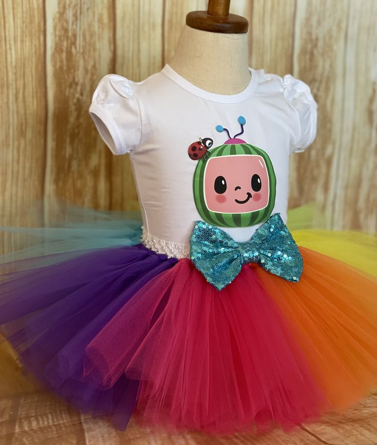 FREE SHIPPING on all orders within the US, no coupon code needed! Cocomelon Rainbow Birthday Tutu Outfit by Little Ladybug Tutus. Handmade Tutus for girls specializing in birthday party dresses, Halloween costumes, flower girl dresses, pageant tutus, 1st birthday tutus, and blinged Converse sneakers. We accept custom orders! ORDER PRODUCTION TIME Please check the top of our website's home page for current turn around time. Since all items are handmade at the time of purchase, there is a producti Whimsical Tutu Dress For Easter Dress-up, Cute Pink Tutu Dress For Costume Party, Pink Summer Tutu Dress For Costume Party, Pink Tutu Dress For Summer Costume Party, Cute Spring Tutu Dress For Costume Party, Whimsical Multicolor Summer Tutu Dress, Cute Tutu Dress For Easter Dress-up, Fun Multicolor Tutu Dress For Dress-up, Fun White Tutu Dress For Birthday