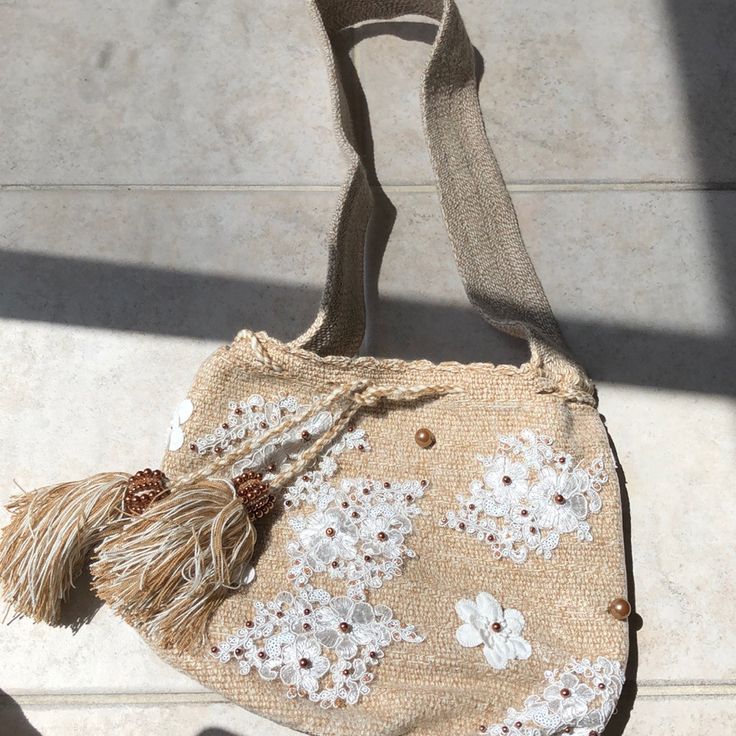 Brand New- With Duster Bag 100% Hand Made In Colombia This Is A Beige Color With White Lace And Rose Gold Beading Summer Beaded Beige Bags, White Pouch Hobo Bag For Shopping, Vacation Beaded Beige Shoulder Bag, White Beaded Bags For Summer, White Beaded Summer Bags, White Bohemian Handheld Bag, Summer White Beaded Bags, Bohemian Cream Beaded Bag, White Beaded Bohemian Shoulder Bag