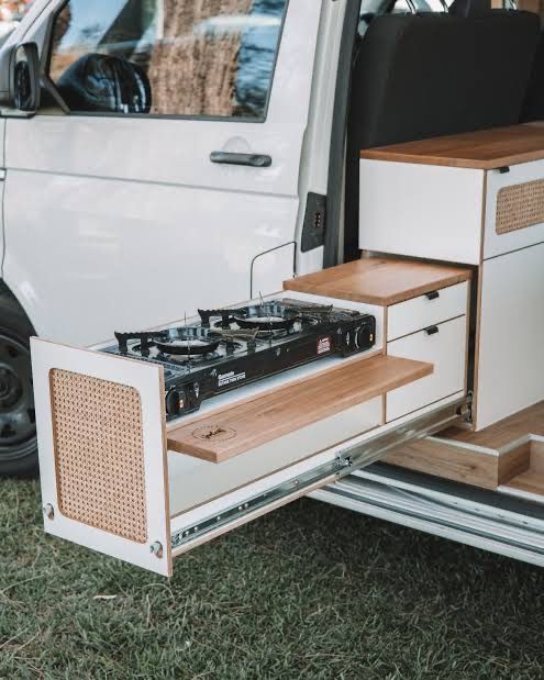 an open white van with drawers on the side