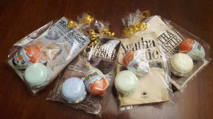 three packaged candies sitting on top of a wooden table