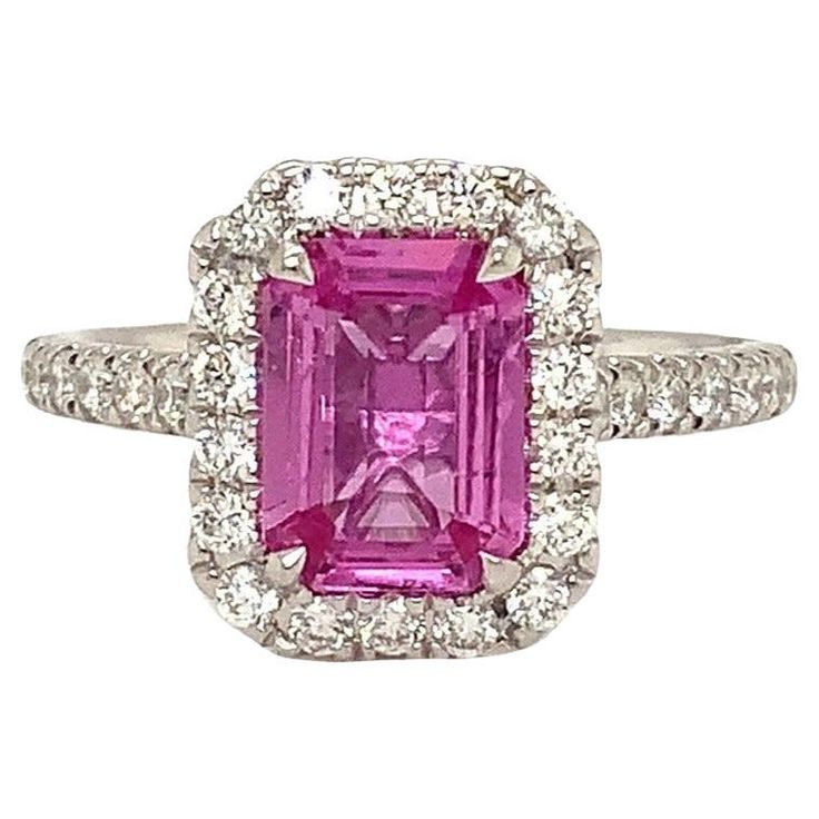 One of a Kind GIA 1.75 ct Certified Emerald Cut Natural Purplish Pink Sapphire Ring is Hand-Made in 18 kt white gold and features 32 brilliant-cut diamonds halo designs totaling 0.49 cts. "Pretty in Pink" is the theme of this Ring. This Beautiful Cotton Candy Pink Color is Stunning in this Diamond Halo design. This GIA Certified No Heat Purplish - Pink Sapphire Certificate #5212914007 Stones certificate of authenticity 1.75 cts Emerald Cut. 8.40 x 6.23 x 3.13 mm Geographic Origin is Madagascar 32 Brilliant Cut Diamonds equal 0.42 cts t.w. F - G in Color VS - Si in Clarity. Very good make and polish. 4.2 grams in Gold Weight and it has a Finger Size of 6.5 Pink Sapphire Diamond Ring, Sapphire Rings, Pink Sapphire Ring, Pink Cotton Candy, Right Hand Rings, Antique Pink, Color Rosa, Sapphire Diamond, Jewelry Rings Engagement