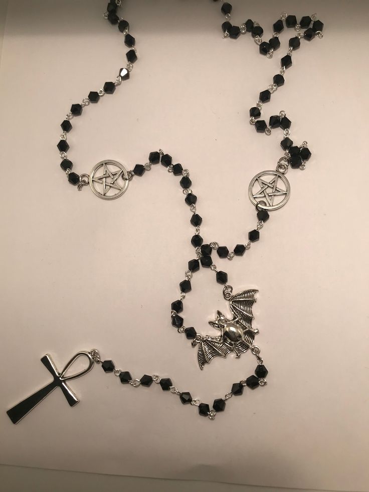 Inspired by vampires.  this rosary has faceted glass beads, pentagrams, bat and ankh.  perfect for the darkling in your life or treat yourself.  Long enough to suit many different body types and sizes.  To make shorter just make a revolution around your neck with the rosary and the pentagrams will lay flat and still be visible.  Will present in organza gift bag, please ask any questions :) Gothic Cross Necklace For Festivals, Gothic Black Beads Jewelry For Halloween, Gothic Black Beads Halloween Jewelry, Gothic Ankh Necklace In Metal, Gothic Ankh Metal Necklace, Goth Rosary, Gothic Rosary, Rosary Style Necklace, Mushroom Ring