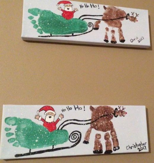 two handprints depicting santa and reindeer pulling a sleigh