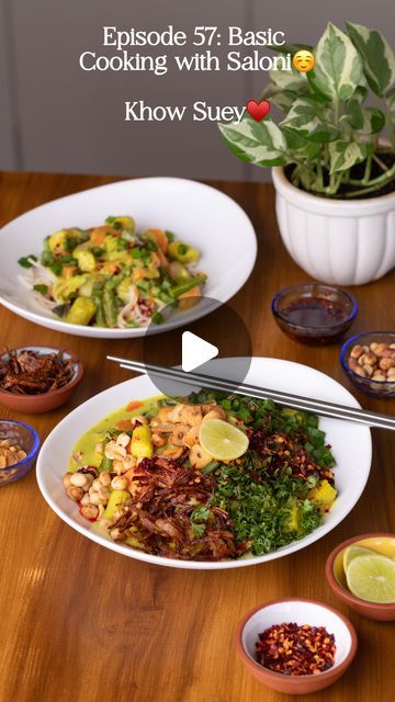 a table topped with plates and bowls filled with food