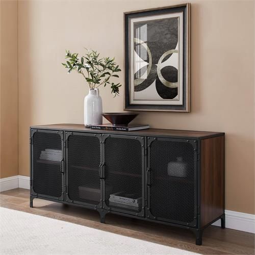 a black and brown sideboard in a living room with a vase on the top