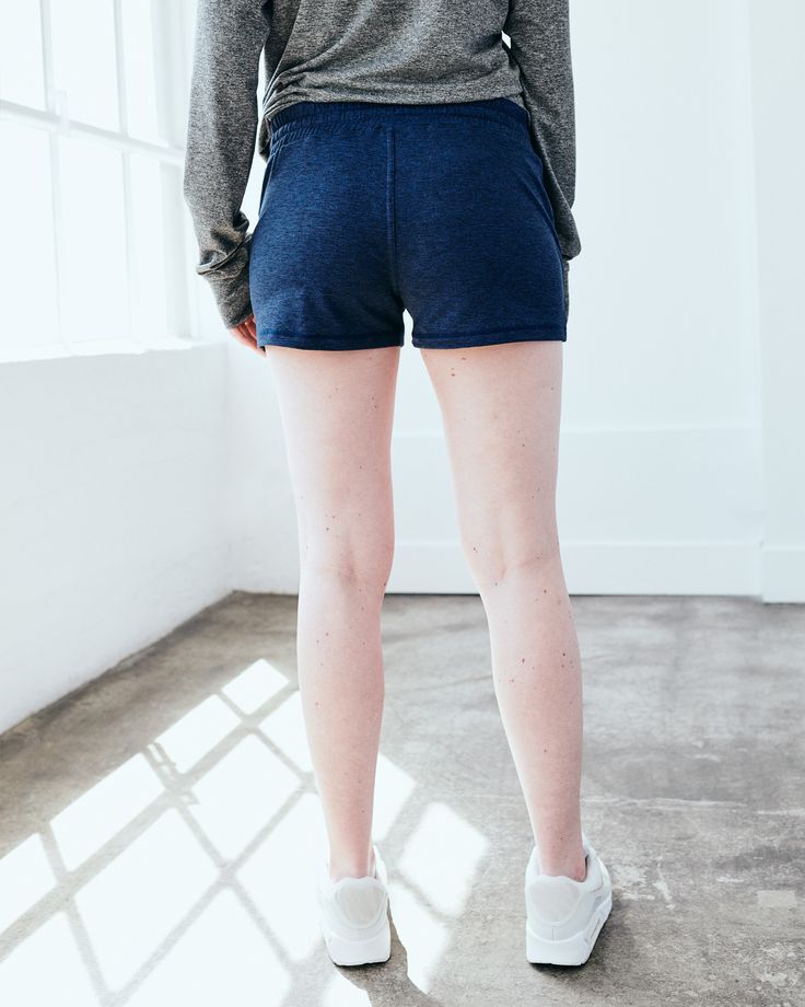 These are just about the coziest shorts you'll ever find, made from our signature Flowknit material. With a bit of stretch, they're designed to move with you - whether you're on a run, running errands, or not running at all. Our Flowknit is made from Global Recycle Standard poly yarn, which diverts and recycles plastics destined for landfill or the ocean, so you can feel and look good in what you wear.  | Quince | Women's Super Soft Performance Shorts in Navy, Flowknit Activewear, Size XS, Recyc Stretch Activewear For Lounging In Short Length, Stretch Activewear For Lounging, Lounging Activewear With Built-in Shorts, Stretch Athleisure Shorts For Loungewear, Stretch Athleisure Shorts For Lounging, Stretch Cotton High-waisted Shorts Activewear, Stretch Cotton High-waisted Activewear Shorts, Athleisure Shorts With Stretch And Comfort Waistband, Athleisure Stretch Shorts For Lounging