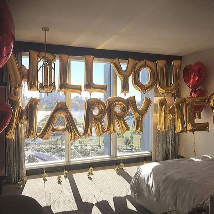 balloons that say you're happy in front of a window with the words balloon letters